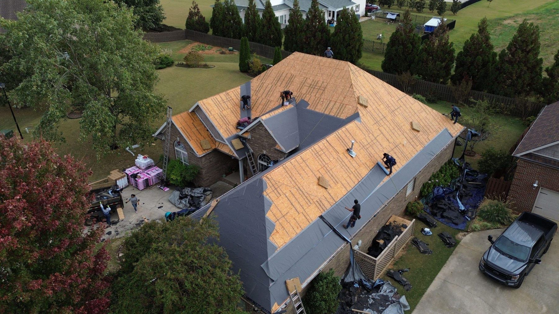 drone shot of an asphalt shingle roof under installation in Colbert County